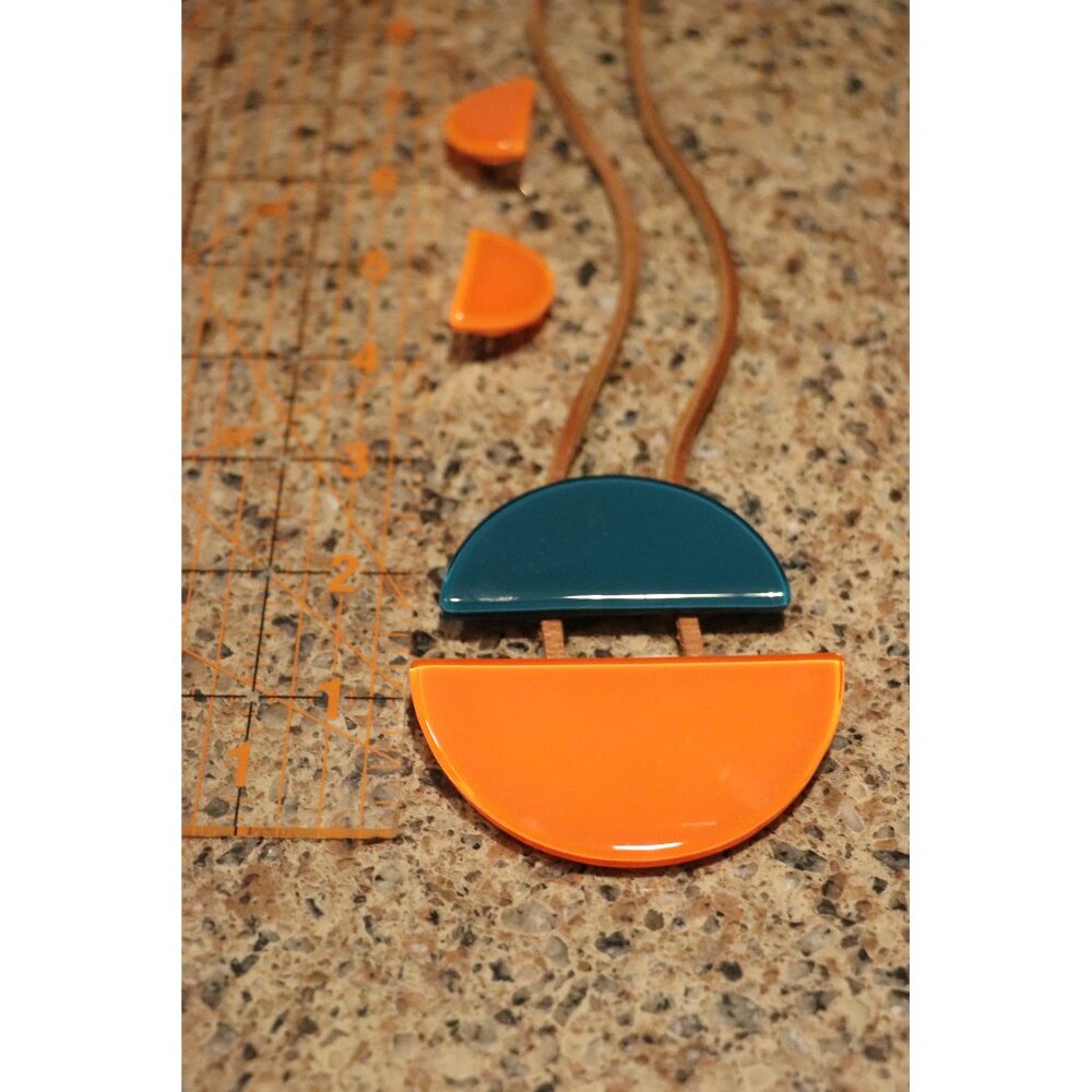 Garda Juno glass necklace (Sienna Blue) and Moon Earrings (Bright Orange)